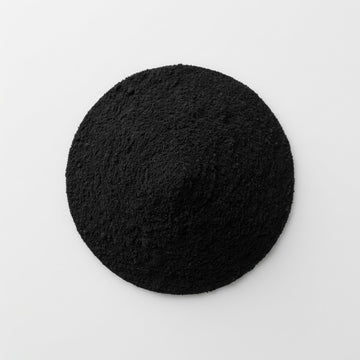 Foto van geactiveerde houtskool als belangrijk ingredient voor Apollo Kauwgom. 
